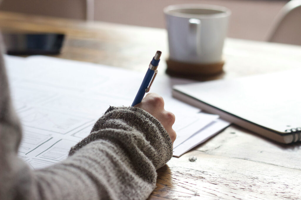 Person working at a desk creating content