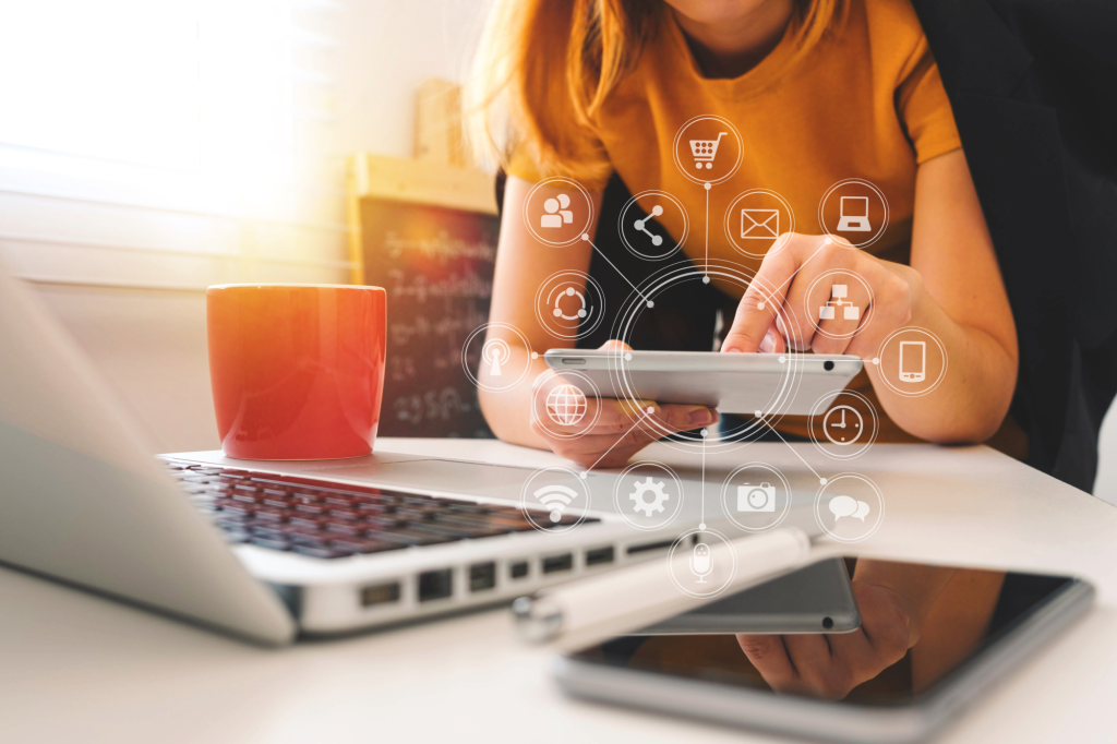 woman working on marketing project using tablet and computer