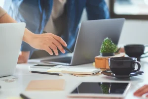 Two people looking at laptop