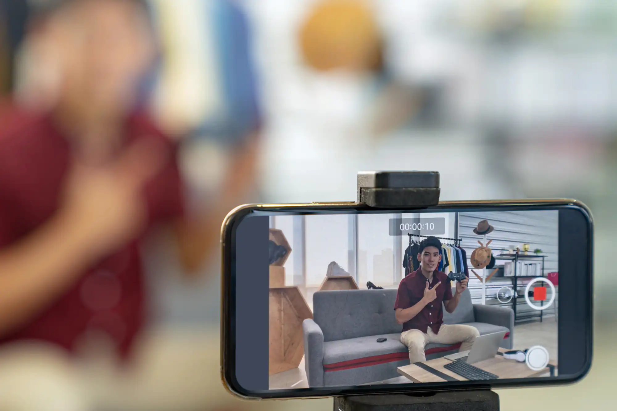 Employee generating social media content with mobile phone