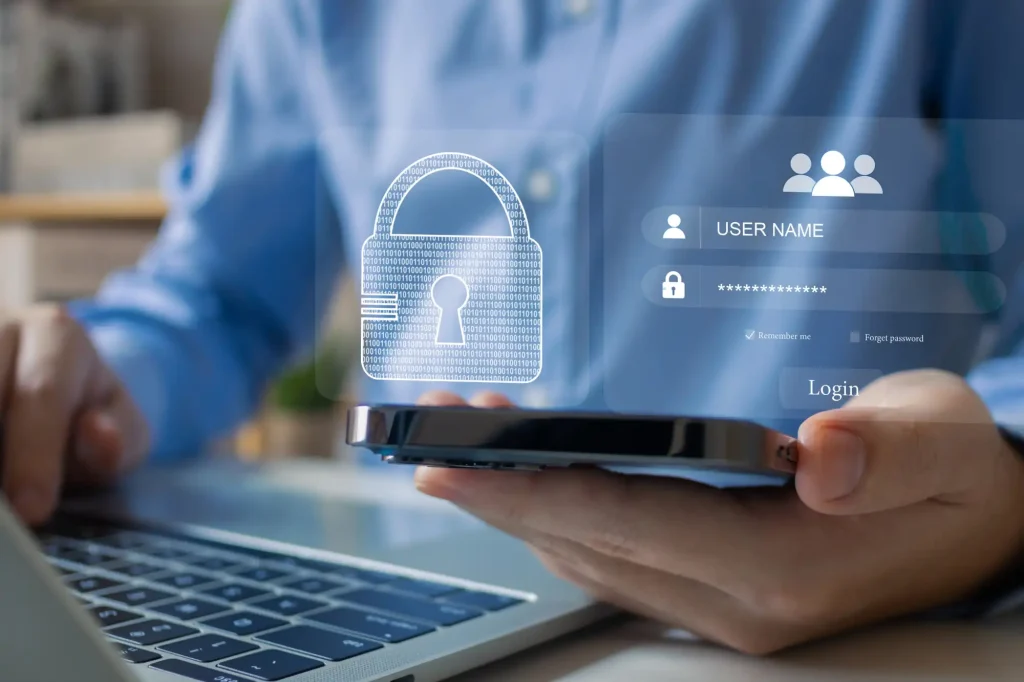 Person looking at secure login on phone and laptop